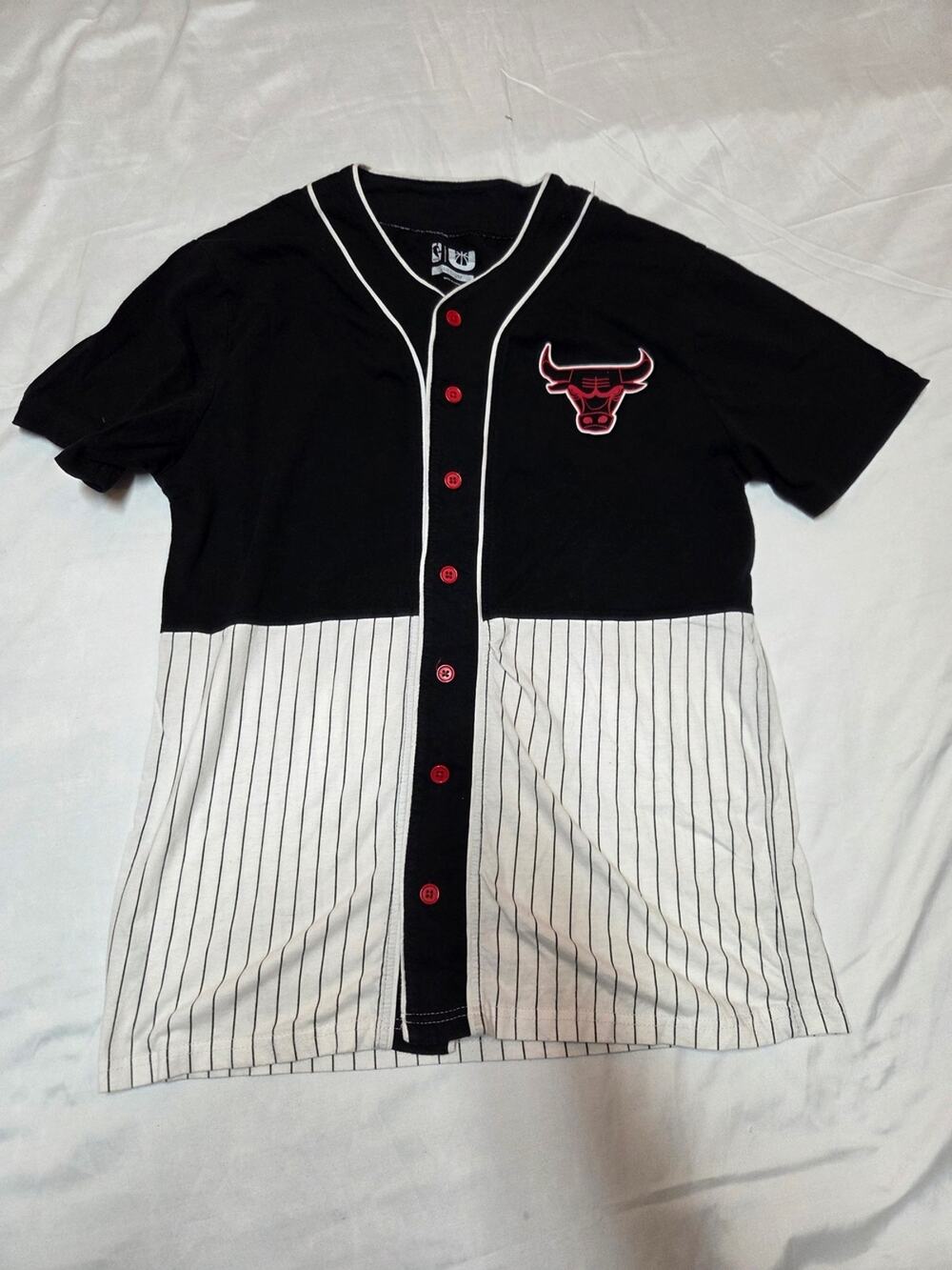 NBA Black Tee with White Trim and Red Button Accent